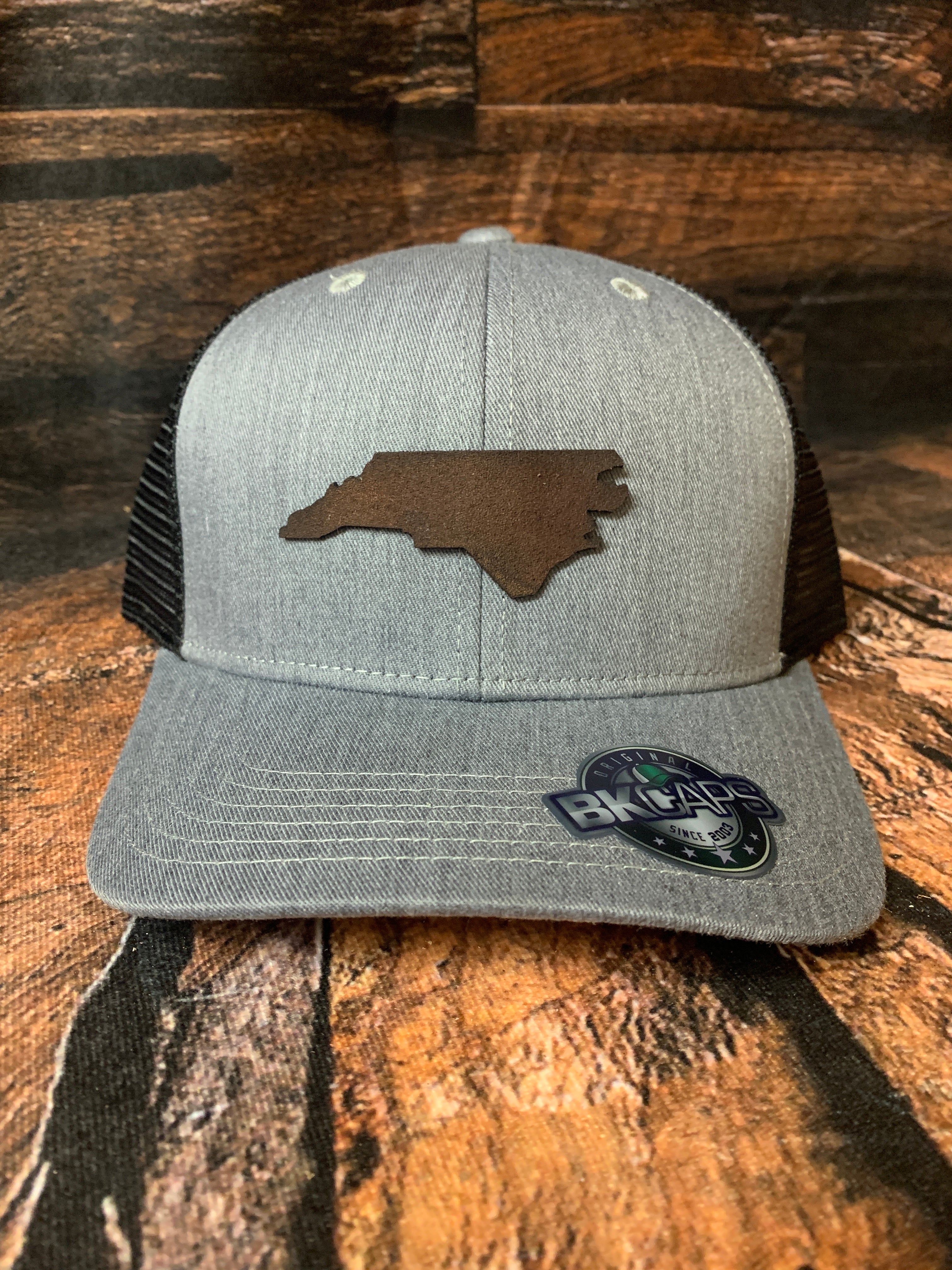Men's Genuine Leather North Carolina Patch Distressed Fabric Trucker Hat